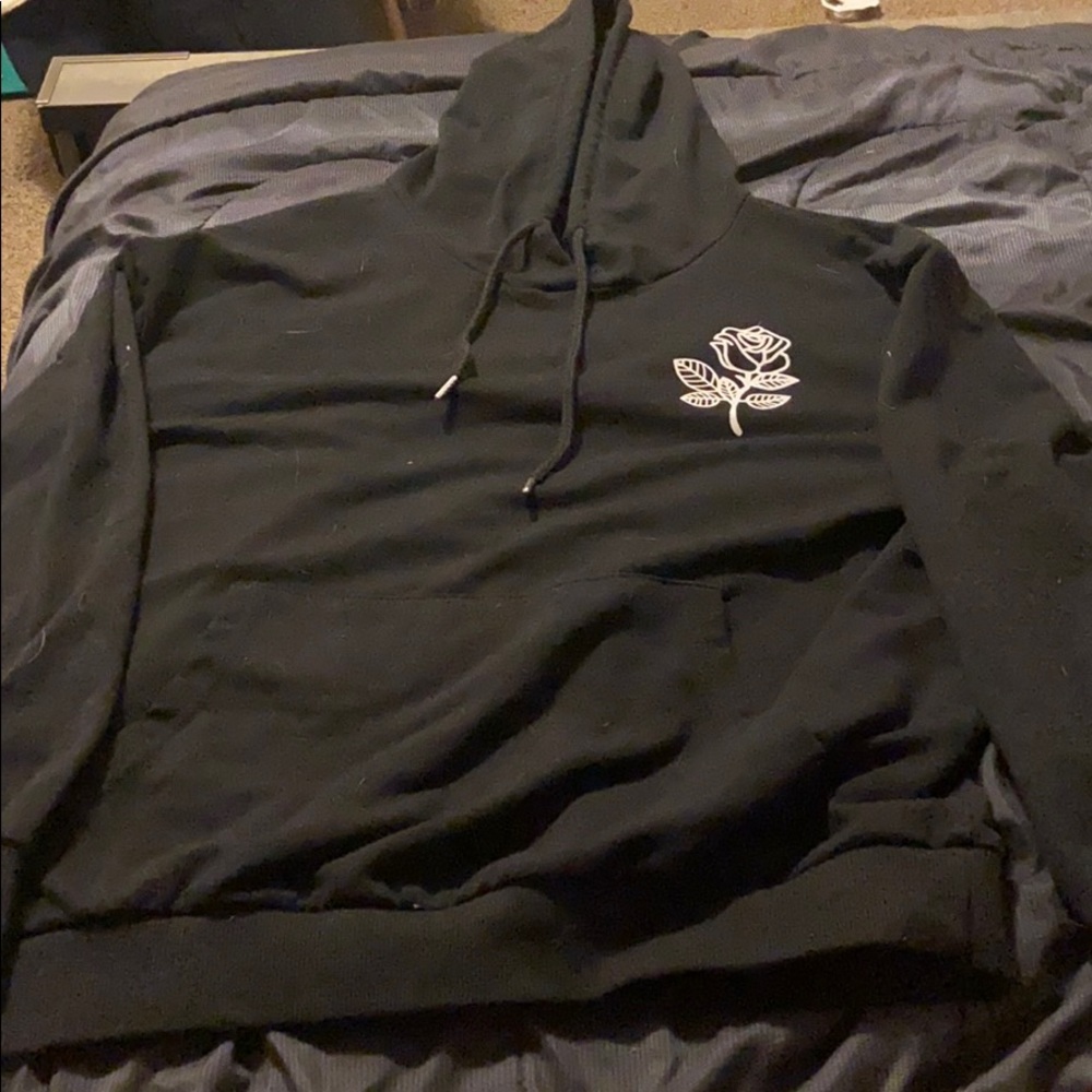 Black hoodie with white rose.